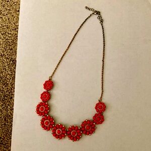 Floral red necklace.